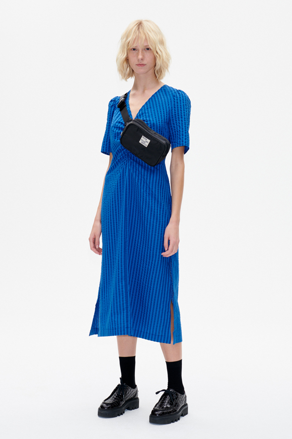 Aranza Dress True Palace Blue An A-line, mid-calf length dress with a V-neck and ruching at the chest - model image