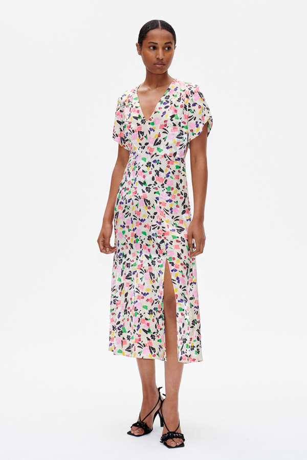 Aiyanna Dress Rose Dandy Flower A mid-calf length dress with an A-line silhouette, zip closure at the side, and V-neck - model image