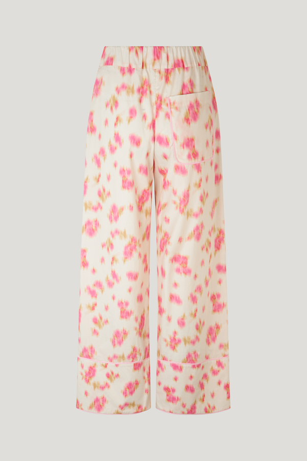 Nala Trousers Pink Fleur Fanee These high-rise, wide-leg soft trousers feature an elasticated waistband, side pockets, and a pocket at the back - back image