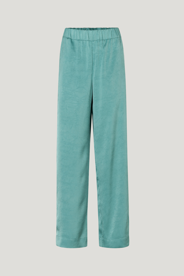 Narine Trousers Trellis These fluid, wide-leg trousers feature an elasticated waistband, side pockets, and raised seams down the sides - front image
