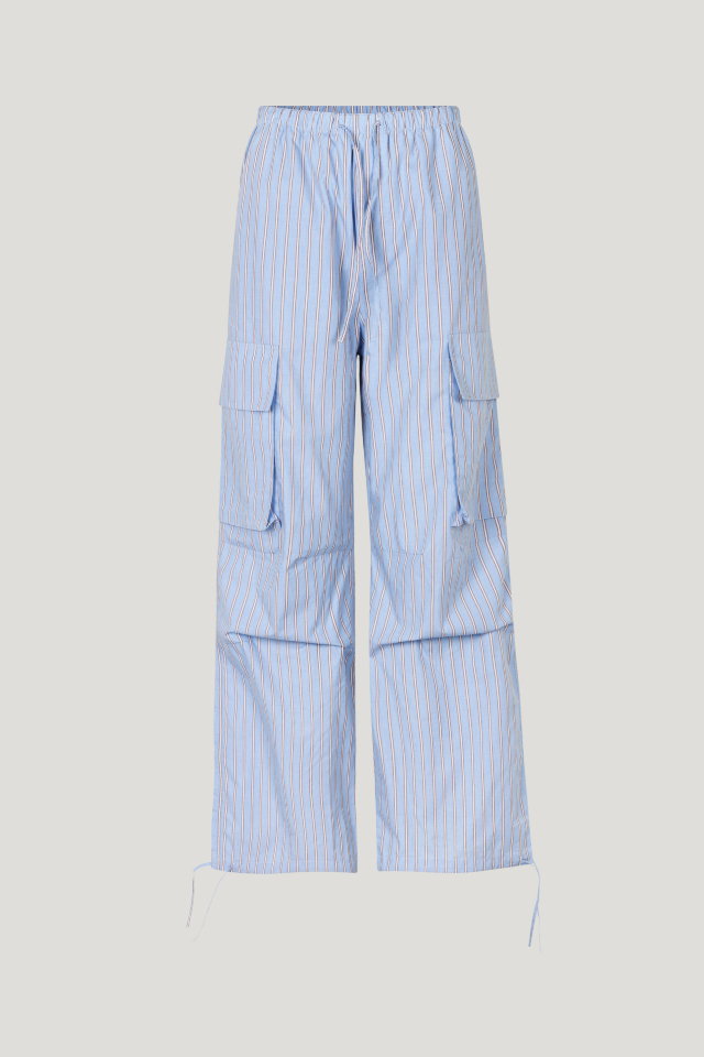 Nasreen Trousers Blue Margot Stripe These low-rise trousers feature wide legs, an elasticated waistband with a drawstring tie, and drawstring ties at the ankles - front image