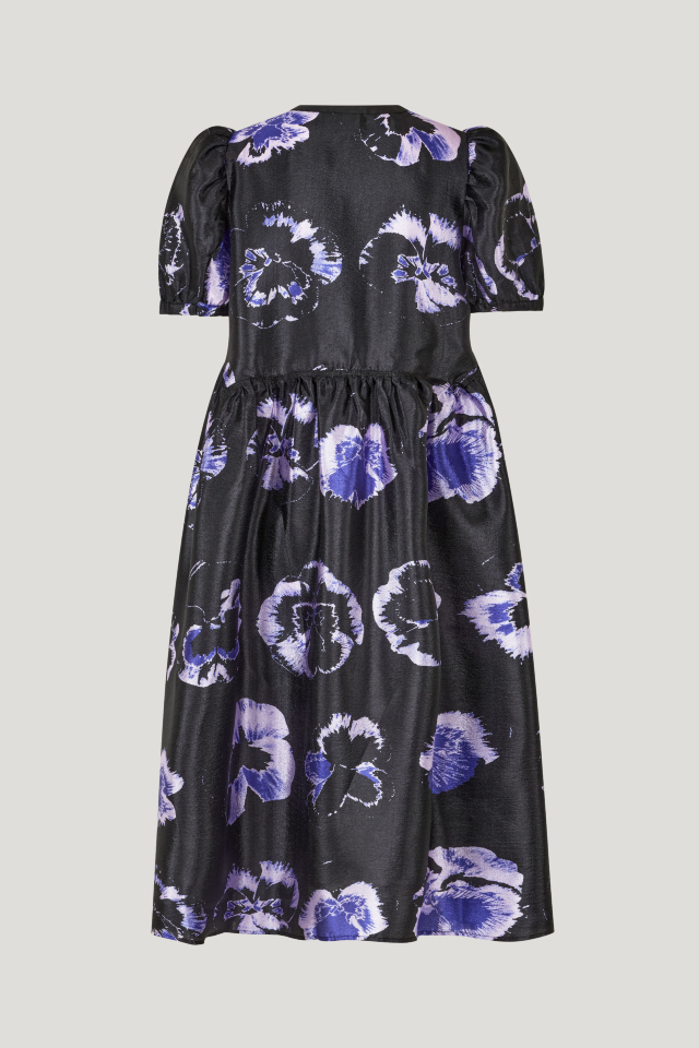 Artemis Dress Purple Pansy This midi-length dress features a button closure with keyhole opening at the front, pockets at the sides, slight puffing at the skirt, and a dipped waistline - back image