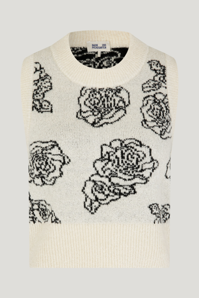 Corry Vest Creme Embroidery Flower This soft, sleeveless sweater vest features ribbing at the neck, hem, and shoulders - front image
