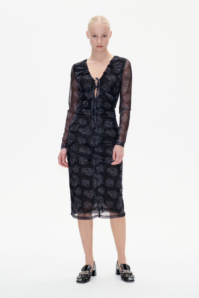 Jezelle Dress Black Embroidery Flower This stretchy, midi-length dress features ruching in the front, back, and sides - model image