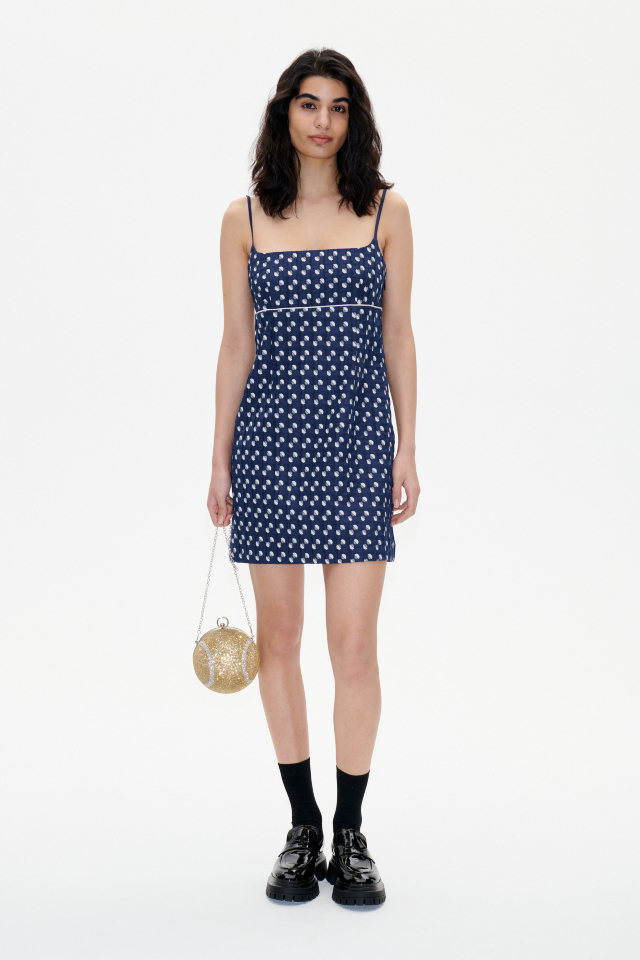 Alvera Dress Blue Jacquard Dot This jacquard minidress features spaghetti straps, a zip closure at the side, and an empire waist - model image