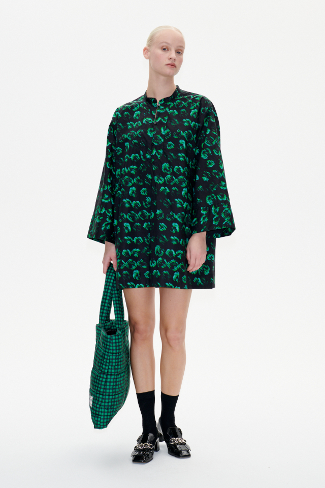 Abi Dress Green Distorted Pansy This loose minidress features cropped sleeves and a buttoned placket at the neck - model image