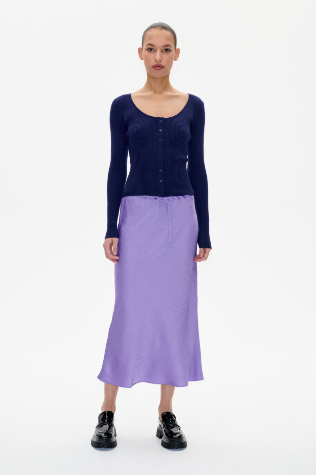 Sinai Skirt Dahlia Purple This midi-length, slip-style skirt features an elasticated waist and drawstring tie at the waist - model image
