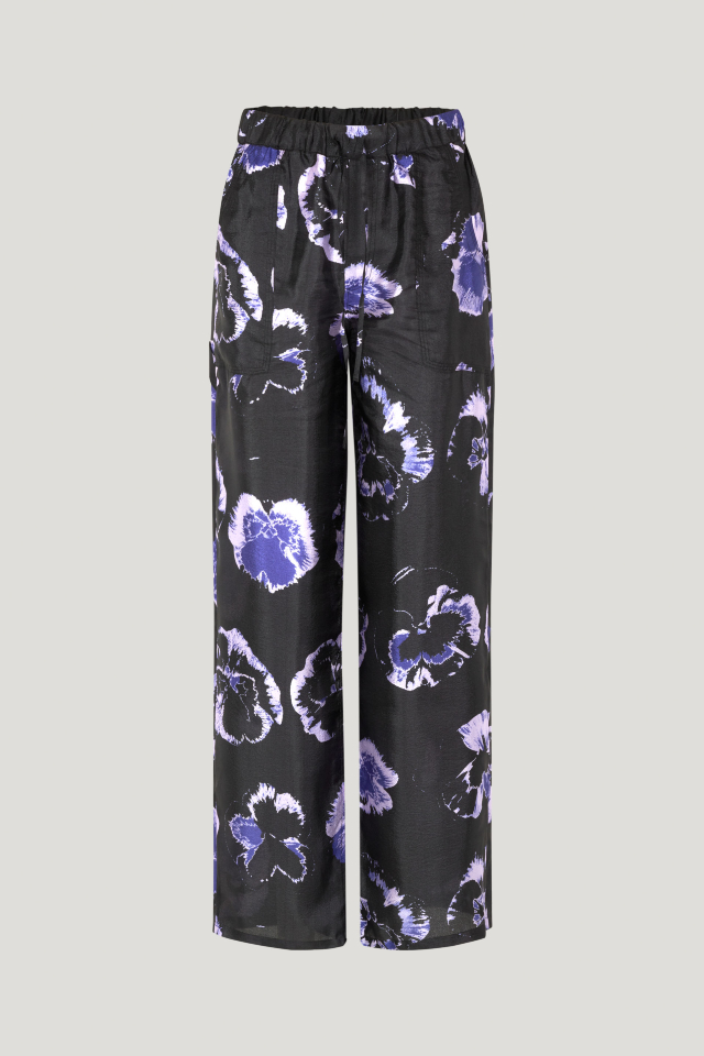Neddie Trousers Purple Pansy These soft, high-rise trousers feature an elasticated waistband, drawstring tie at the waist, side pockets, and back pockets - front image